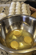 cracked eggs in a bowl 