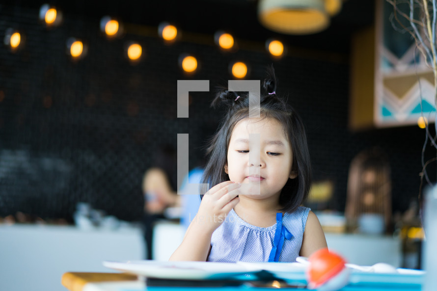 a toddler eating food 