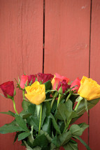 bouquet of yellow, red, pink and orange roses