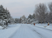snow covered neighborhood street 