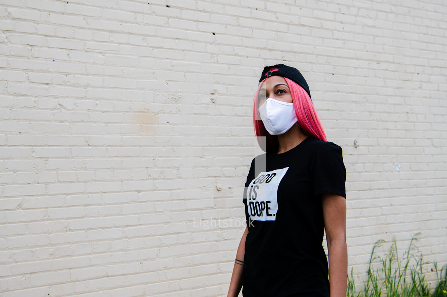 a portrait of a young African American woman in a face mask with copy space 