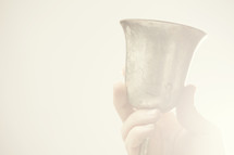Jesus holding a chalice 