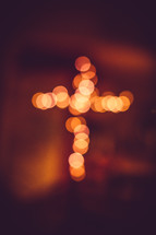 bokeh lights in the shape of a cross