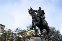Bronze statue of a man on a horse.