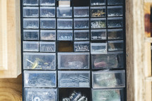 Nails and screws organized in bins