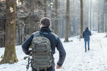 men hiking in the snow 