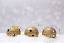 gold bells in snow 
