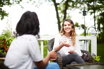 women talking outdoors 