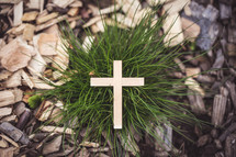 wood cross in grass 