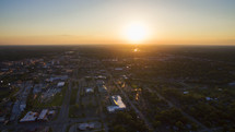aerial view over a town at sunset