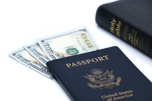 cash and American passports on a white background 