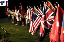 people holding flags from various nations 