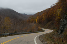 curve on a mountain road in fall 