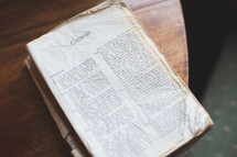 A old Bible opened to Genesis 