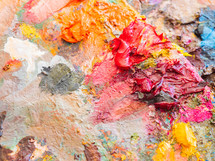  Artists multicolored oil paints on wooden palette or canvas. Close up abstract background. Art concept.