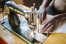 woman using a sewing machine 