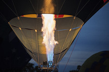 rising hot air balloons at night 