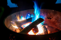 blue flames in a fire pit 