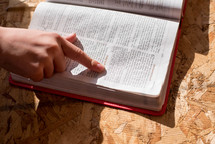 reading a Bible with underlined scripture 