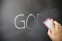 erase the word God from a blackboard 