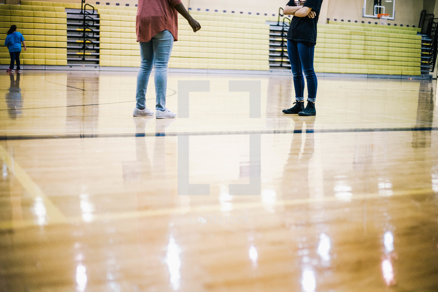 teens standing in a gym 