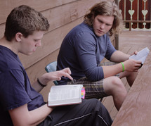 young men reading Bibles at a Bible study 