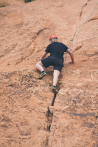 a man rock climbing 