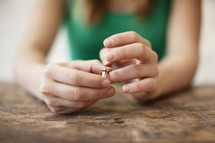 Woman playing with a wedding ring on her finger. 
