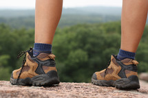 hiking boots on a mountaintop 