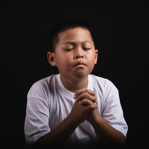 Boy praying to God