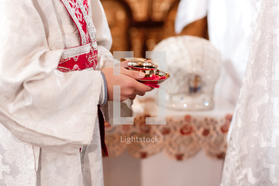Priest holding communion