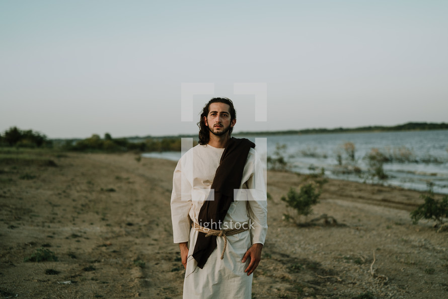Jesus standing on a shore 
