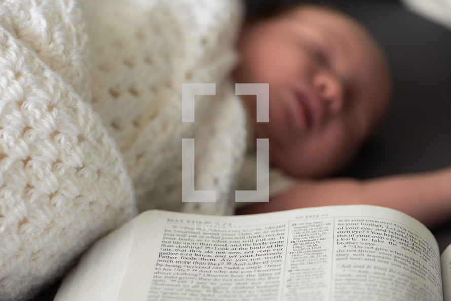 newborn and open Bible 