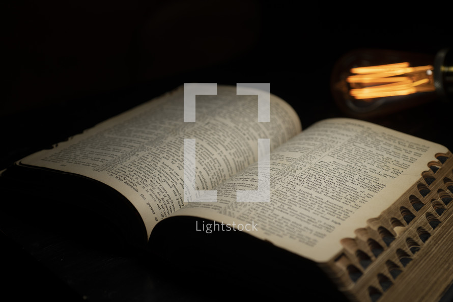open Bible and Edison Bulb 