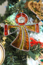 stained glass ornament on a Christmas tree