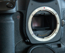 Metal mount of a DSLR digital camera with mirror down.