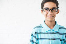 boy child wearing reading glasses and a smirk 