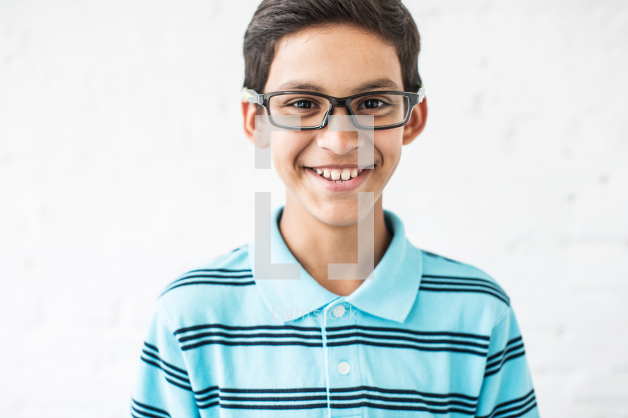 smiling boy child with glasses 