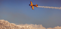 a plane flying over snowy mountain peaks 