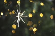 star ornament on a Christmas tree