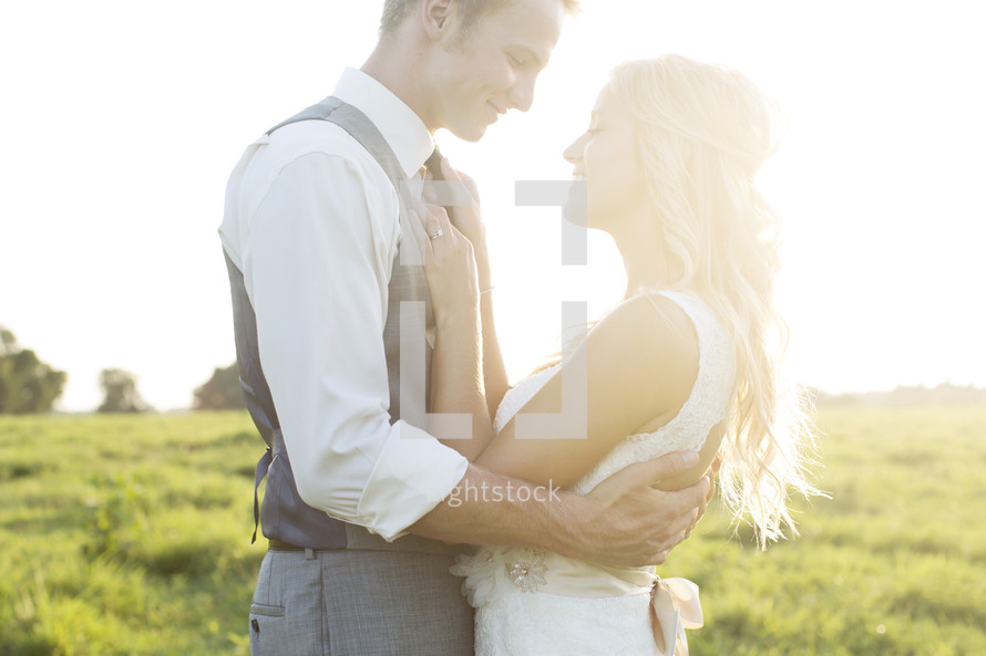 portrait of a bride and groom and intense sunlight 