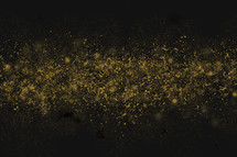 gold sparkle on a black background 