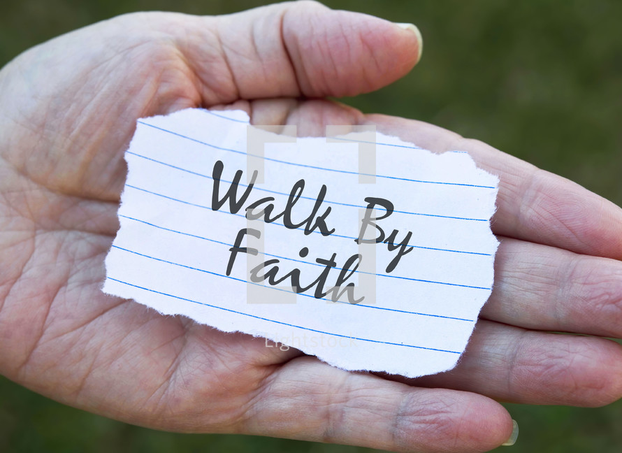 walk by faith note in the palm of a hand 