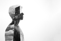double exposure of a man and empty cross 