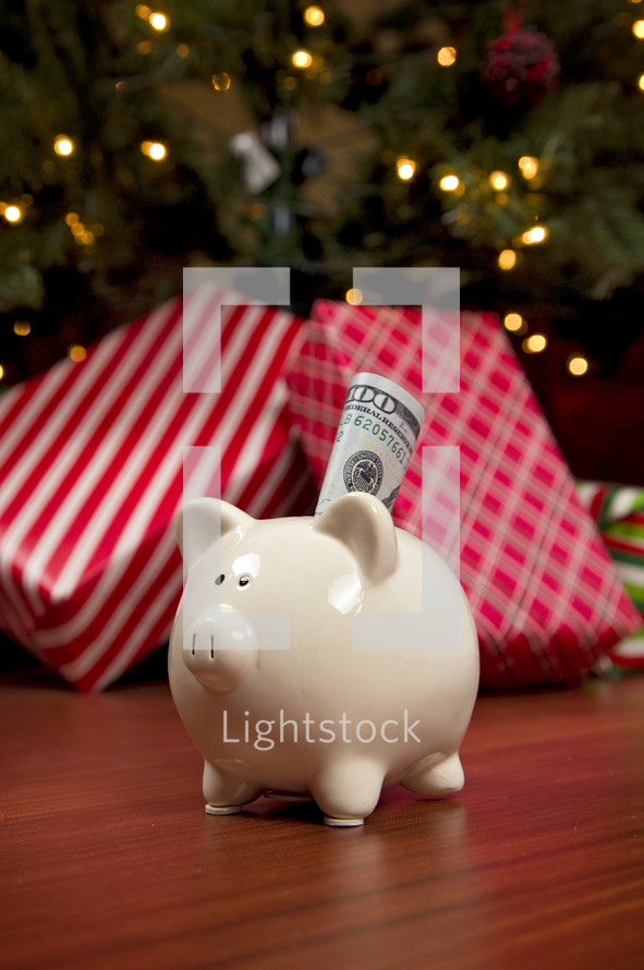 cash in a piggy bank and a Christmas tree 