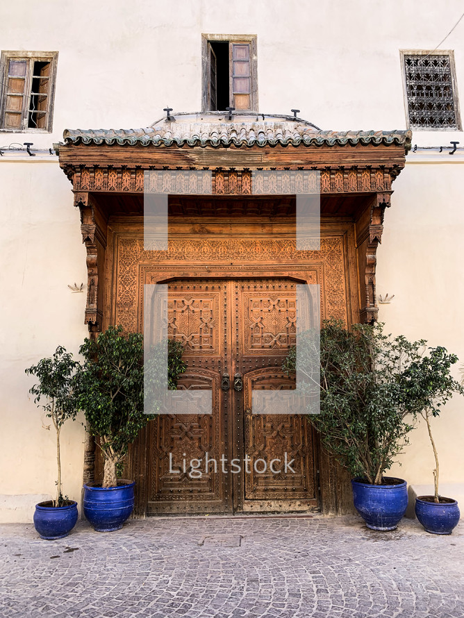 large ornate double wooden doors 