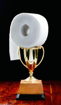 toilet paper and a trophy 