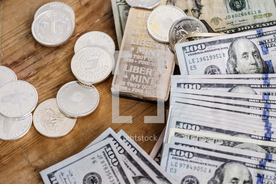 cash and coins on a table 