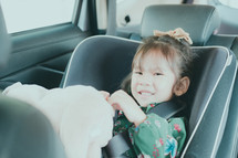 a child in a car seat 
