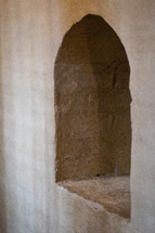 A window arch in a stone wall